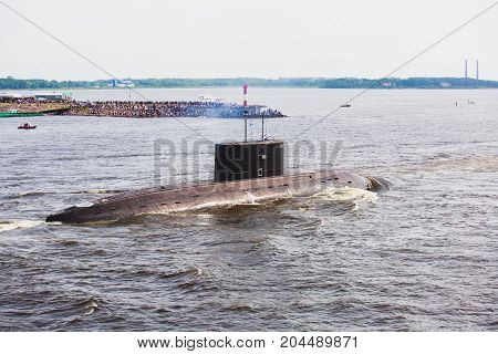 A line of modern russian military submarine cruisers in the row, northern fleet and baltic sea fleet in the open sea, submarine