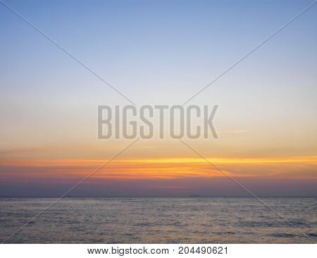 Yellow-red sunset sky above the sea. Torpical evening