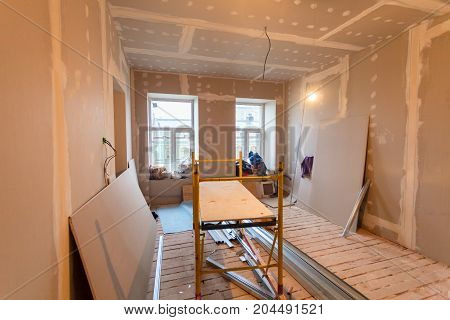 Material for repairs in an apartment is under construction remodeling rebuilding and renovation. Making walls from gypsum plasterboard or drywall.