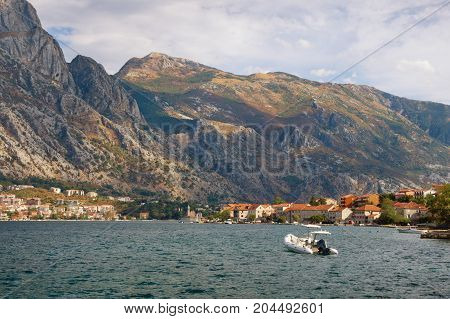 Autumn view of Lovcen mountain from Prcanj town. Bay of Kotor (Adriatic Sea), Montenegro