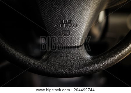 SRS (supplemental restraint system) airbag (vehicle safety device) for reduce the risk of injury in crashes and car horn sound sign in steering wheel - interior car concept.