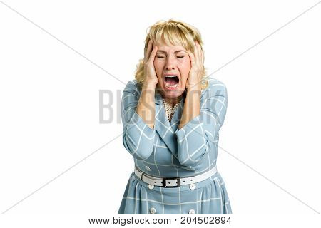 Portrait of screaming dissapointed woman. Portrait of stressed and frustrated white-skin woman screaming with desperate and horrified expression, white background.
