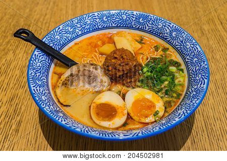 Japanese Tamago Spicy Ramen With Cha Shu Pork On Wooden Background