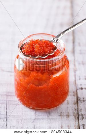 Red And Black Caviar In Small Silver Spoon On A Wood Background With Black Bread ,food Concept