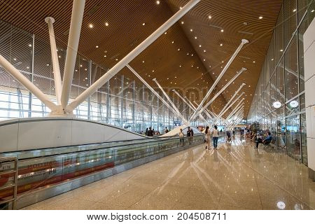 Kuala Lumpur Malaysia - July 22 2017: Inside of Kuala Lumpur International Airports (KLIA) terminal with many people are waiting to transfer the international flight.