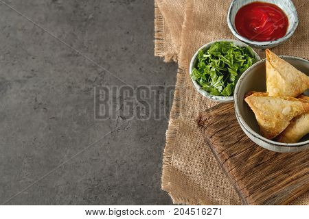 Asian Food. Vegetarian Samsa With Tomato Sauce And Herbs. Dark B