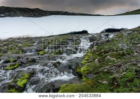 Waterfall in the mountains along the National tourist route Aurlandstjellet. Flotane. Western Norway