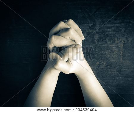 close up photo of praying child hands.