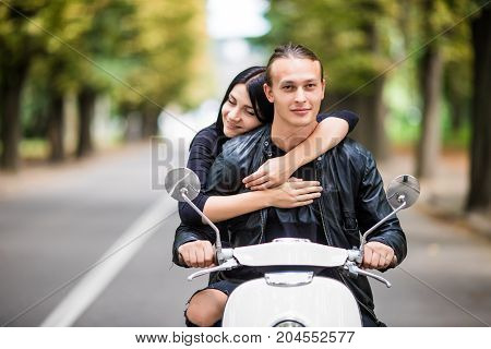 Couple In Love Riding A Motorbike. Handsome Guy And Young Sexy Woman Travel Hug.