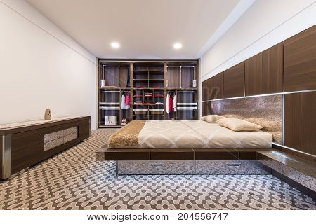 Built In Warderobe And Double Bed In Bedroom Interior