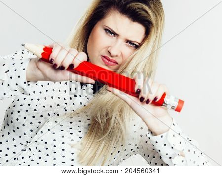 Angry Woman Holds Big Pencil In Hand