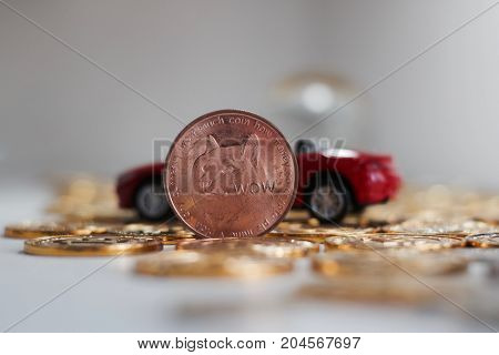 Brass Dogecoin Coin Near Red Car