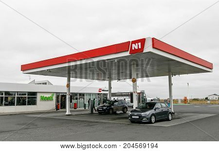 Iceland August 24 2017: A couple of cars are receiving gasoline at an N1 gas station.