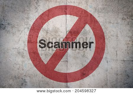 Word Scammer written over a traffic sign on vintage background