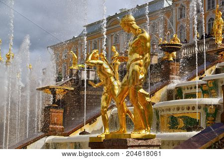 Peterhof, Russia - June 03. 2017. Gold sculptures of the Great Cascade Fountain