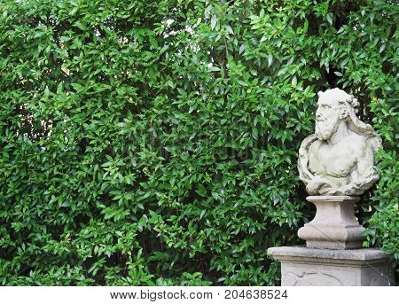 old European Italian park in Padua green wall bench sculpture