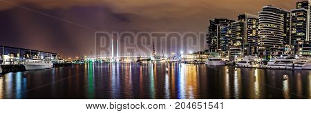 Panorama view of a beautiful view of docklands and The Bolte Bridge at night in Melbourne Australia.