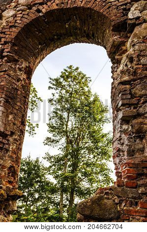 very old Kazdangas church wall of stones.