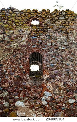 very old Kazdangas church wall of stones.