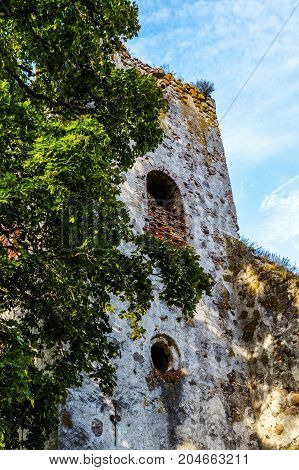 very old Kazdangas church wall of stones.