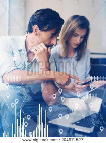 Concept of digital diagram, graph interfaces, virtual screen, connections icon.Teamwork process.Young business people working with new startup project.Blurred background.Vertical