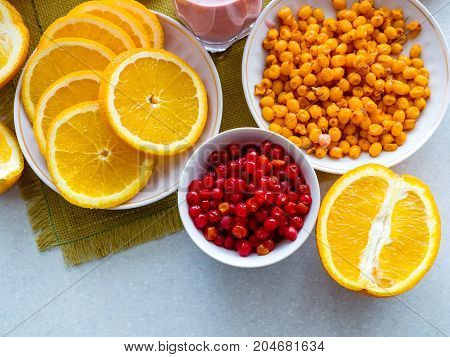 Oranges and berries of cranberry and cranberry on the table. Healthy Eating, Vitamin, Detoxification, Dietary Nutrition, Clean Food Concept