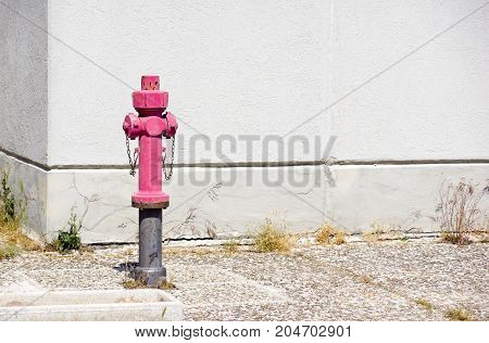Old red fire hydrant in the street. Fire hidrant for emergency fire access .