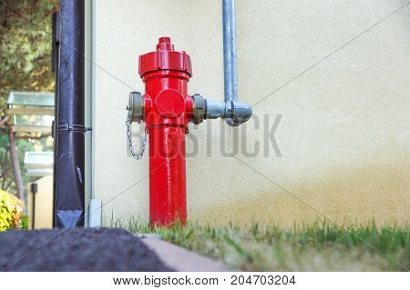 Old red fire hydrant in the street. Fire hidrant for emergency fire access .