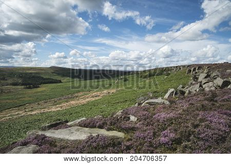 Beautiful Vibrant Landscape Image Of Burbage Edge And Rocks In Summer In Peak District England