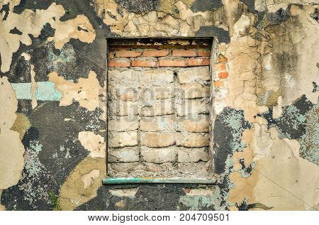 Creative wall background. Walled window and old ruined wall.