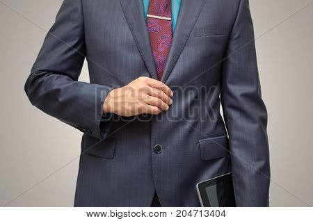 Product presentation. Promotion. Market research. Business man holding in hand tablet PC with blank screen close up.