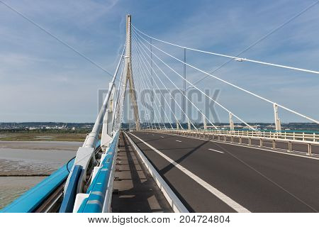 Pylon with steel cables from French bridge Pont de Normandie over river Seine