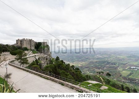 Castle dedicated to goddess Venus on Erice mountain. In the background the plain of Trapani