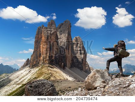 Drei Zinnen or Tre Cime di Lavaredo with hiker Sextener Dolomiten or Dolomiti di Sesto South Tirol Dolomiten mountains view Italien Alps