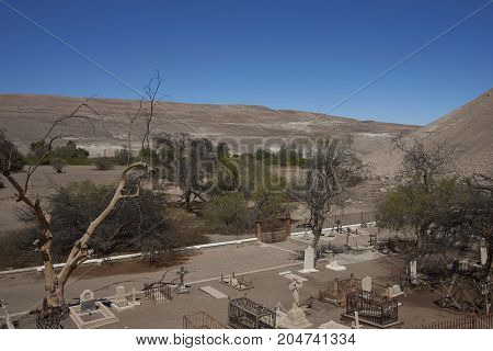 Tiliviche, Tarapaca Region, Chile - August 21, 2017: Historic British Cemetery from the era of nitrate mining in the Atacama Desert, in the grounds of Hacienda Tiliviche in northern Chile.