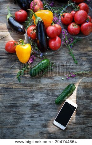 High Angle View of Grilled Meal of Steak, Chicken and Vegetables Spread Out on Rustic Wooden Table at Barbeque Party. Grilled meat and vegetables on rustic wooden table. Summer picnic time.