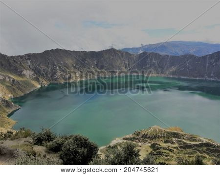 Quiet turquoise lagoon in the volcano crater