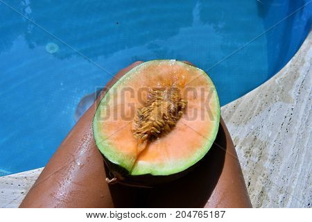 summer time. tropical mood. warm sea. summer vacation. yellow melon. body and fruits. juicy melon. summer day. fruits pool. fruits and sea. vacation time. swimming pool. swimming pool food. healthy fruit. spa vacation. travel concept. relax time