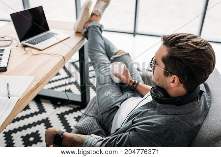 Man Drinking Coffee At Workplace