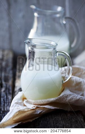 Homemade serum in a Pitcher in rustic style