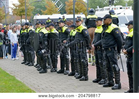 ENSCHEDE THE NETHERLANDS - SEPT 17 2017: Police taking care of security during an anti-islam demonstration of Pegida. Pegida is a group of people who are against the islamization of Europe.