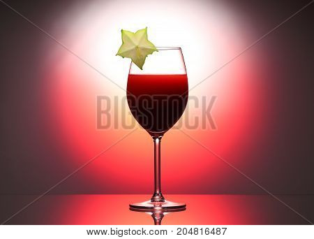 Wineglass Red Liquid Cocktail Decorated With Green Carambola In Studio Pink Background.