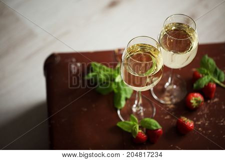 Wineglasses With White Wine Decorated With Strawberry And Mint