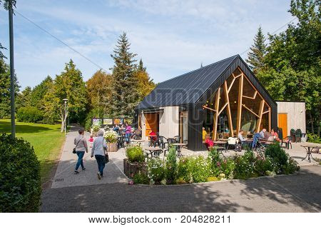 Akureyri Iceland - August 22. 2017: People eating at a coffee shop in Akureyri botanic Garden