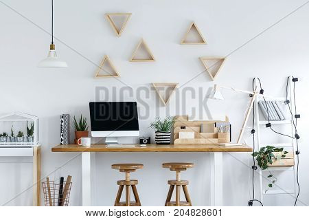 Wooden Stools At A Desk