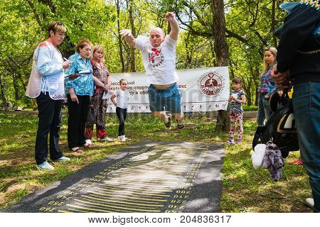 The Athlete Does Exercises During A Public Open Competition For Doing Standards Trp In Kirov City In