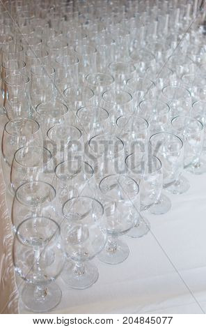 Wineglasses before fourchette clear and crystal. Selective focus