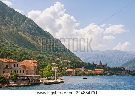 View of Kotor Bay and Prcanj town on a summer day. Montenegro
