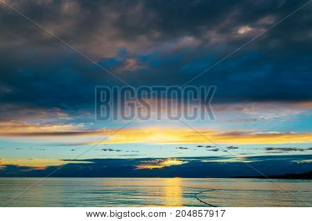 Summer holiday by the sea. Sunset on the seashore. City View Walk along the seafront