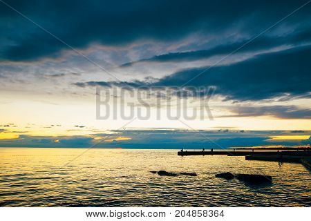 Summer holiday by the sea. Sunset on the seashore. City View Walk along the seafront